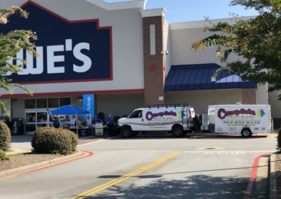 Lowe's store with Complete Heat and Air truck and trailer in front